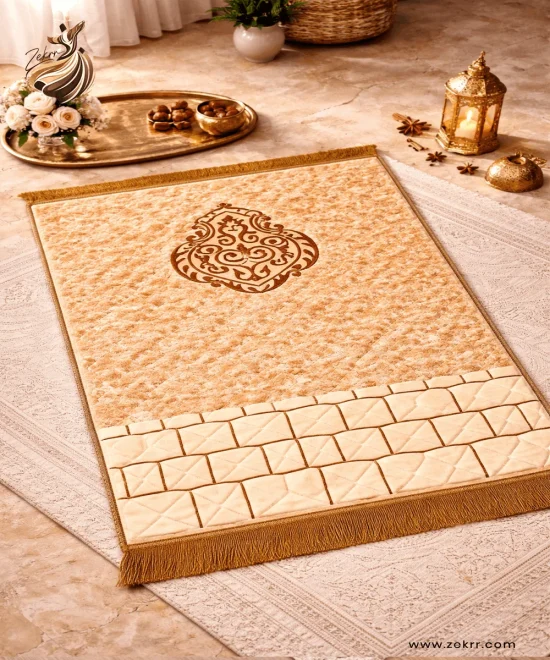 Golden beige luxury velvet prayer mat with embossed Islamic motif and cushioned surface by ZEKRR